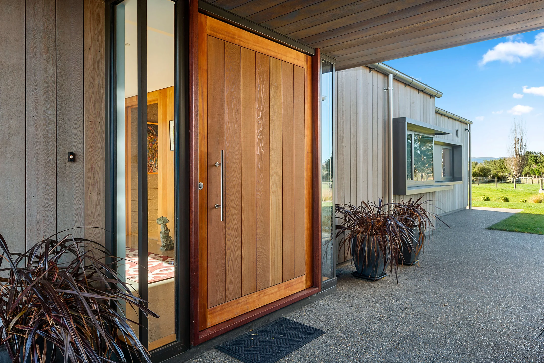 Crafted timber entrance and carefully finished cladding