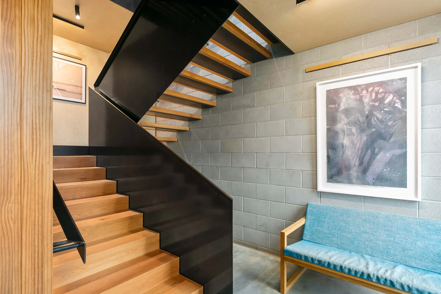 Timber staircase with carefully detailed steel balustrade