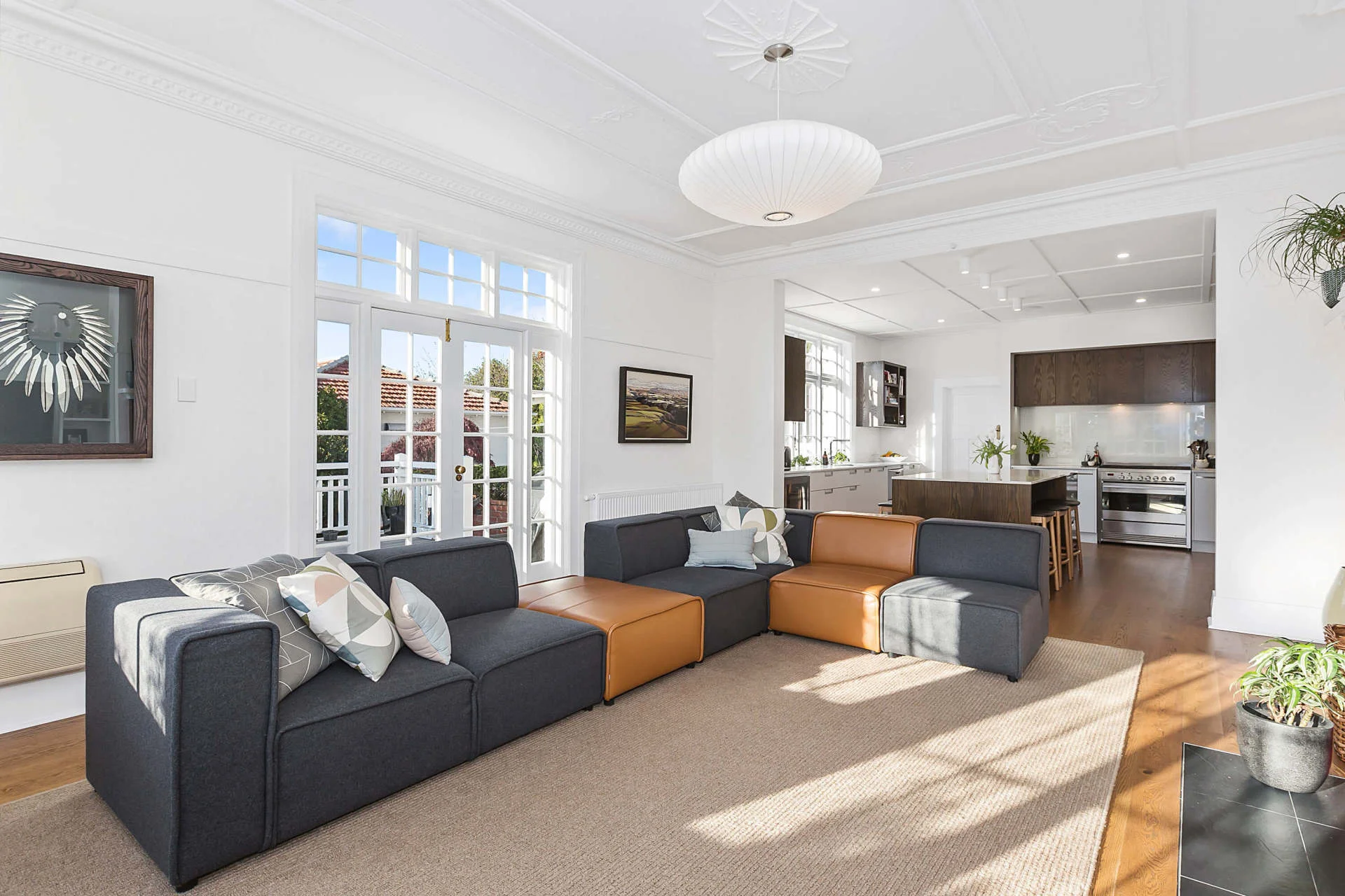Renovated open-plan living room connected to the kitchen