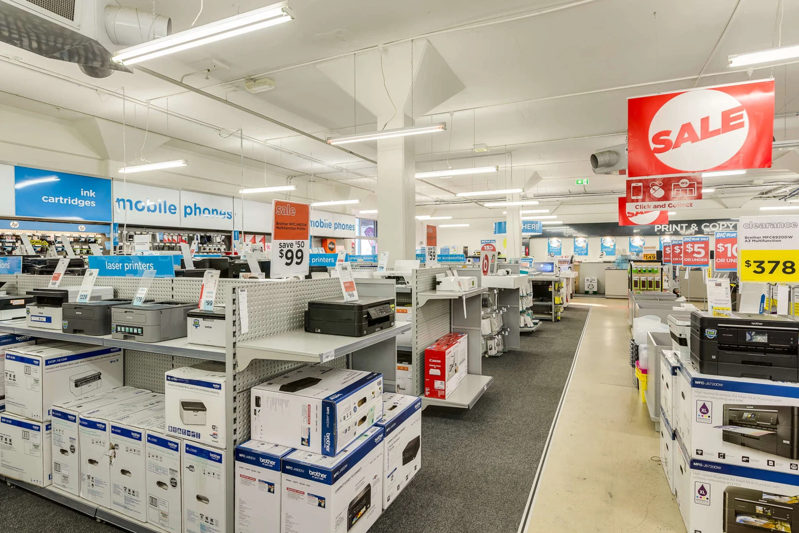 Warehouse Stationery retail interior with product aisles and overhead lighting