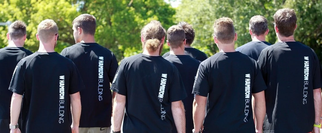 WHB team members wearing branded work shirts
